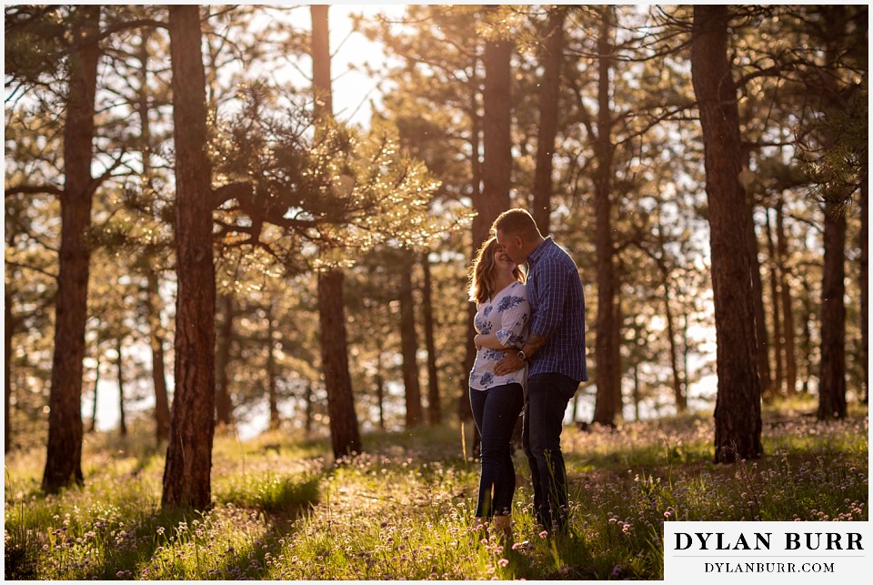 golden colorado mountain enagagement photo session couple dancing bringing her in close