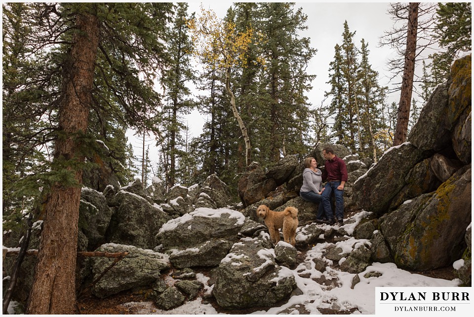 colorado mountain engagement session snow on large mountain rocks