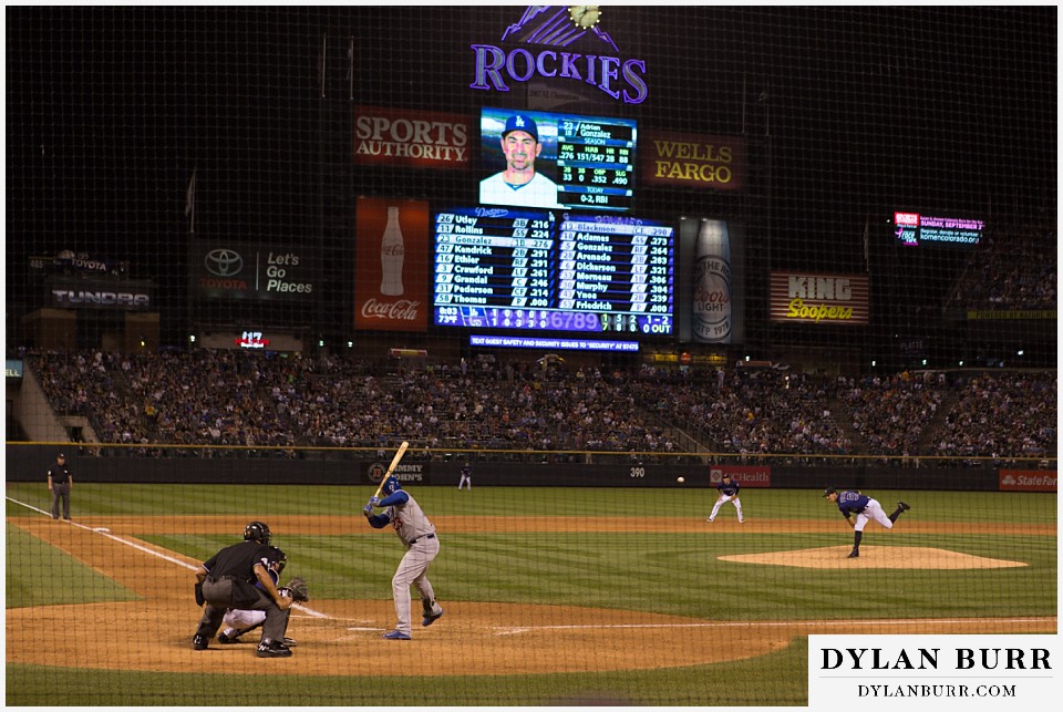 proposal at coors field rockies game close up of pitcher throwing