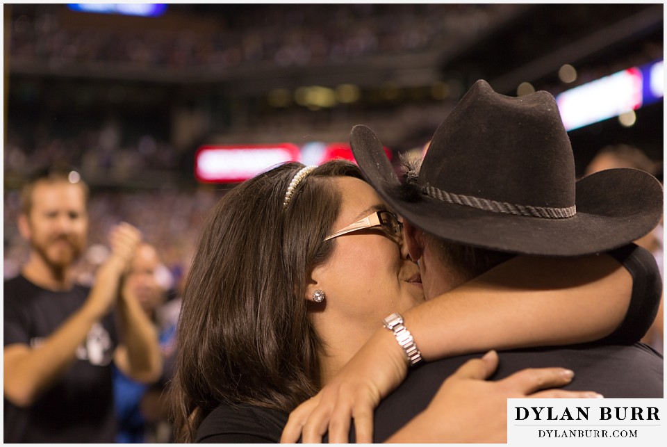 proposal at coors field rockies game cheek kisses