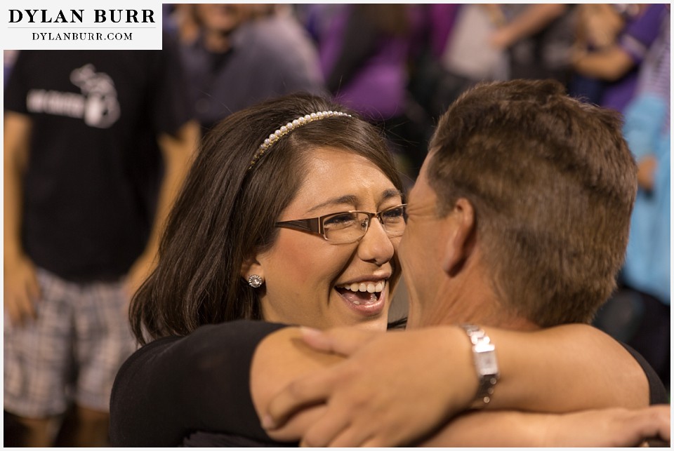 proposal at coors field rockies game couple with pure joy