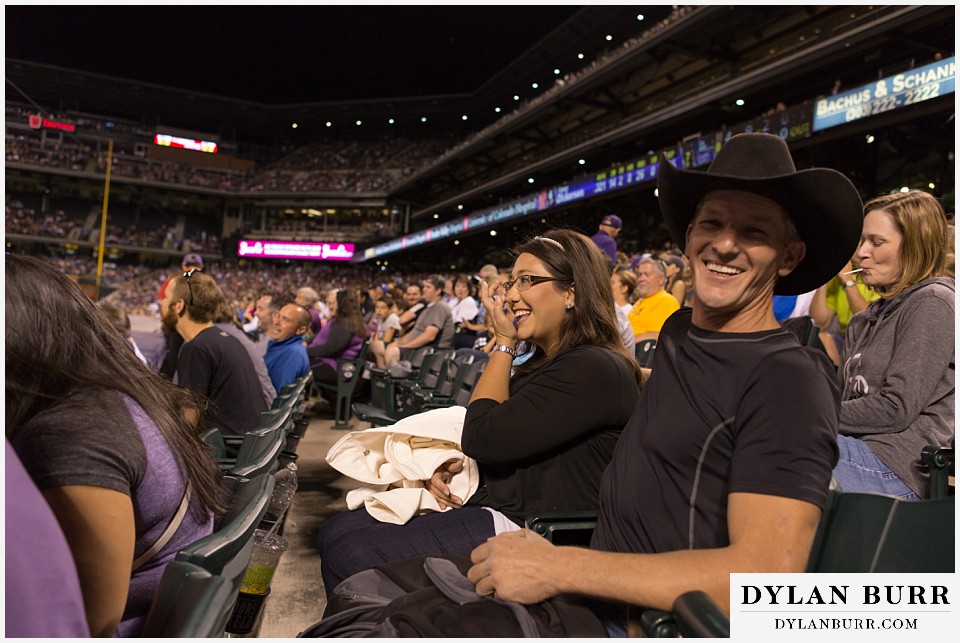 proposal at coors field rockies game couple in super joy high