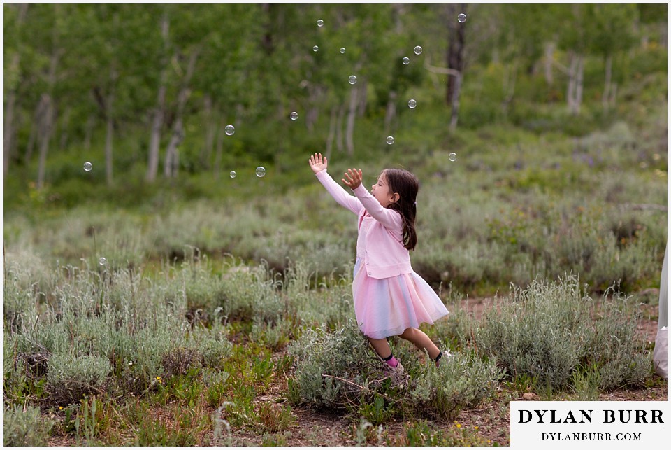 crested butte land trust wedding crested butte colorado girl chasing bubbles