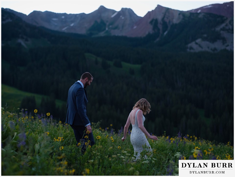 crested butte wedding elopement walking in mountain wildflowers