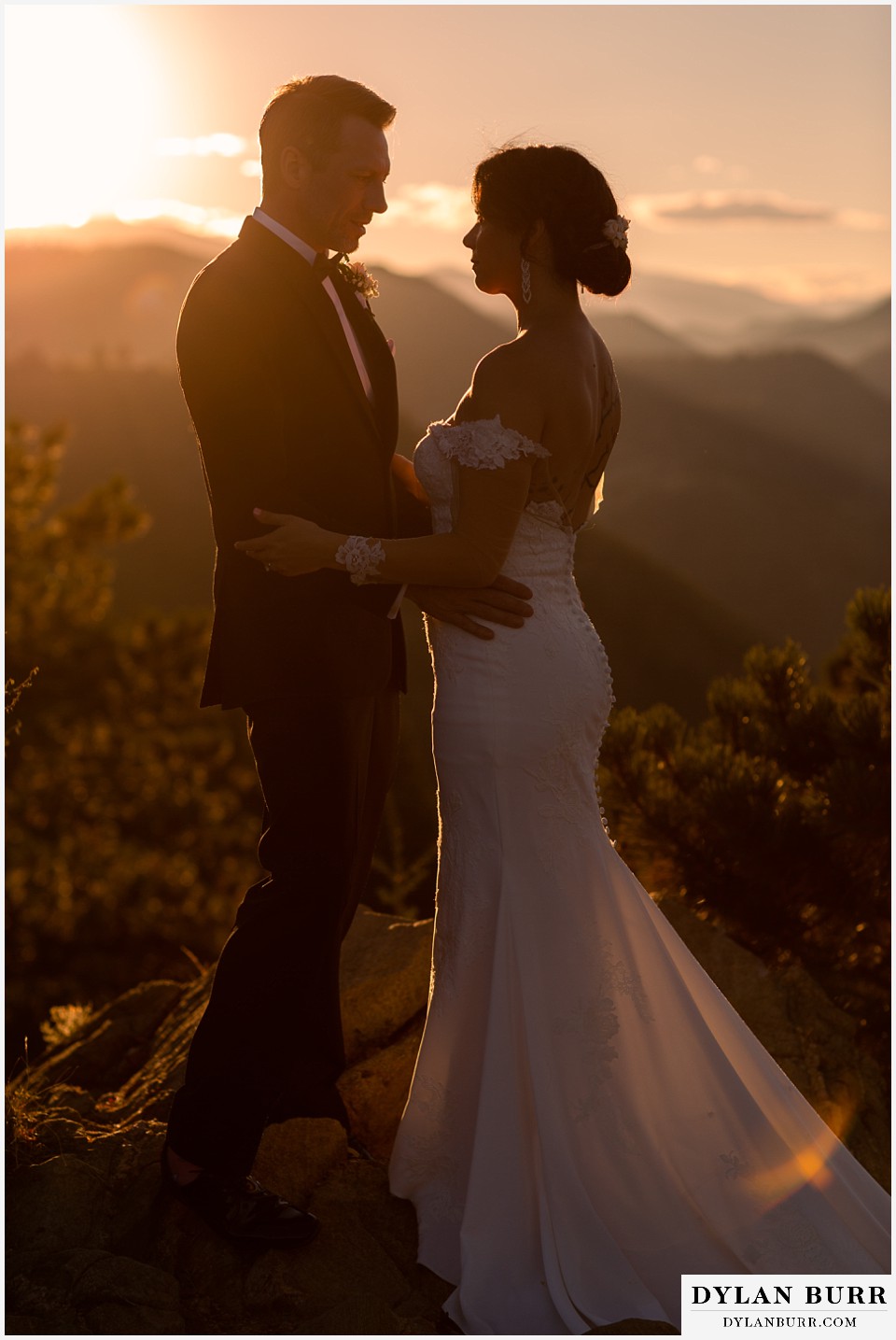 bride and groom at sunset on top of mountains
