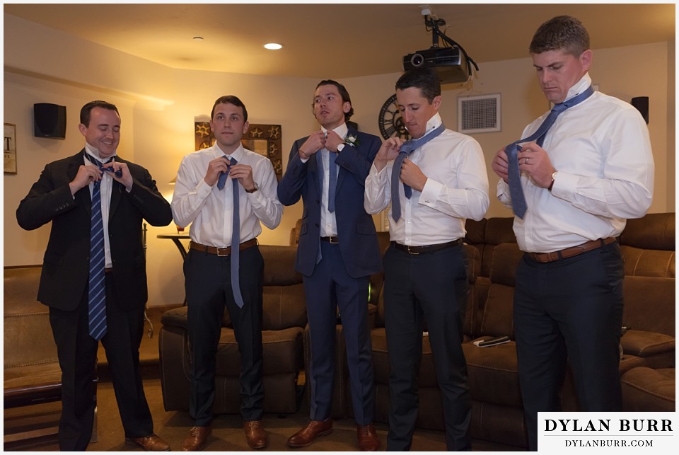 della terra wedding estes park colorado mountain wedding groomsmen getting ready in movie theater