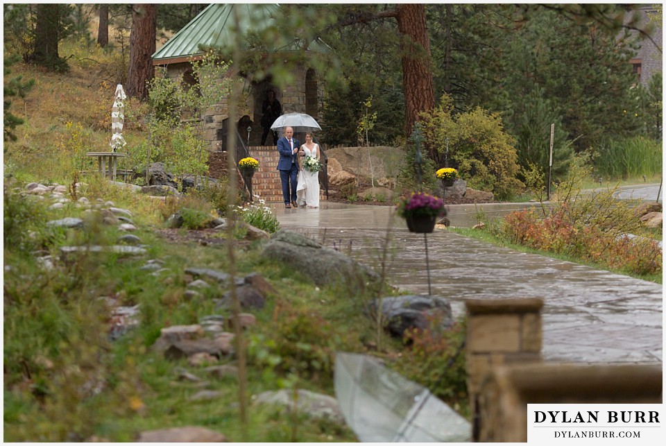 della terra wedding estes park colorado mountain wedding bride walking to ceremony site