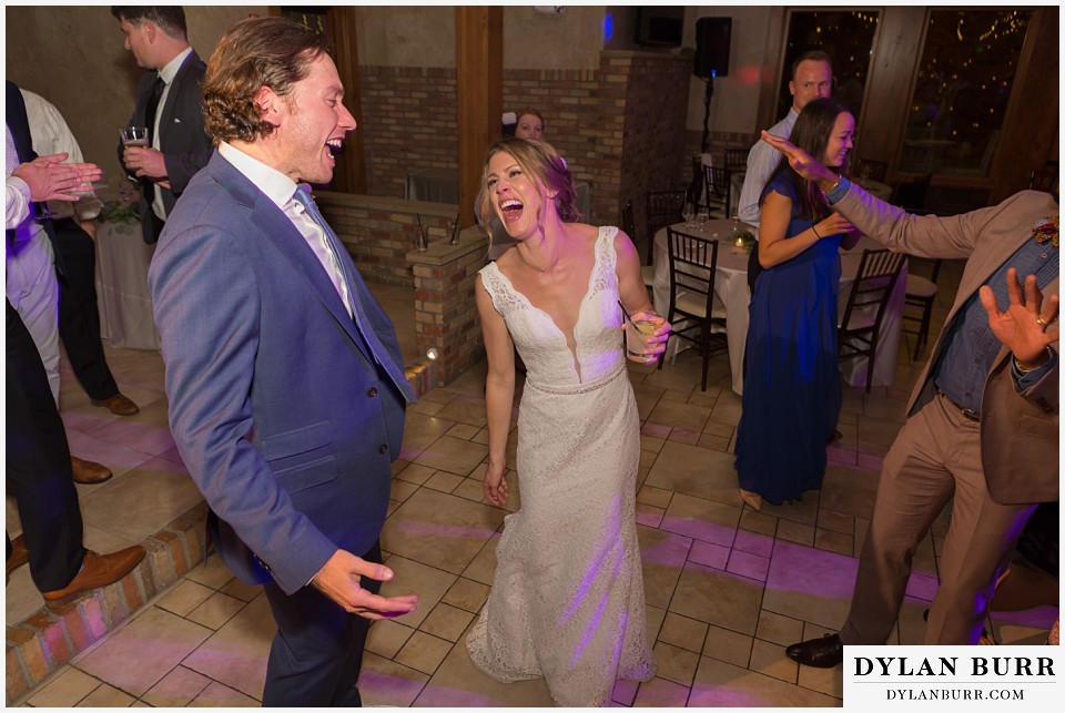 della terra wedding estes park colorado mountain wedding couple singing together