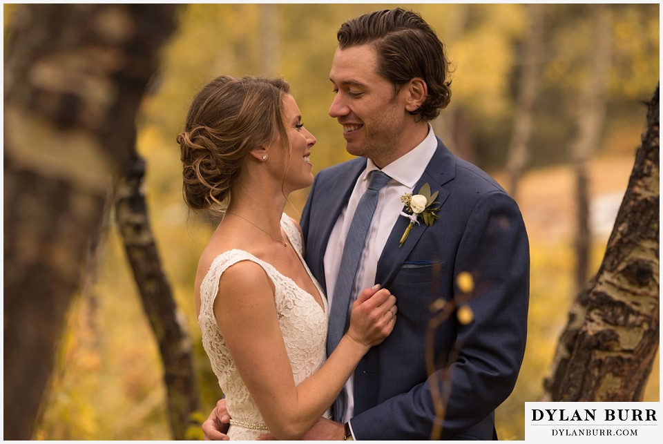 della terra wedding estes park colorado mountain wedding couple in fall aspen trees