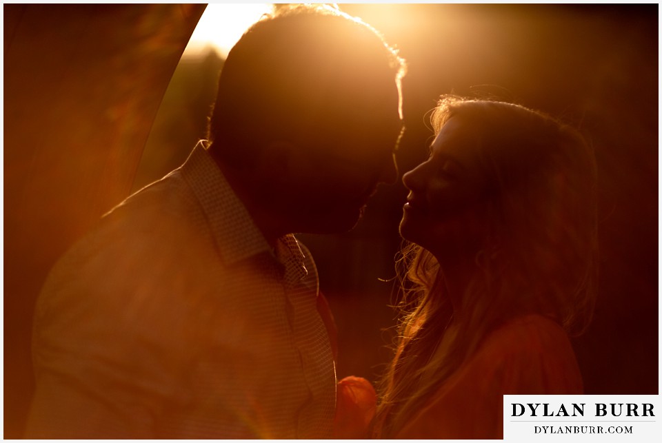 sunset kisses at denver botanic gardens engagement photo session