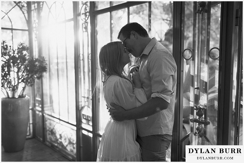 snuggling in close at the woodland mosaic in denver botanic gardens engagement photos