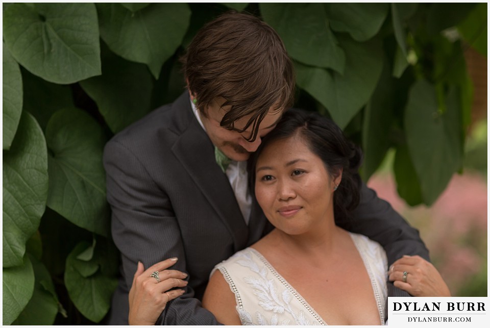 denver botanic gardens wedding colorado woodland mosaic bride groom near giant vine leaves