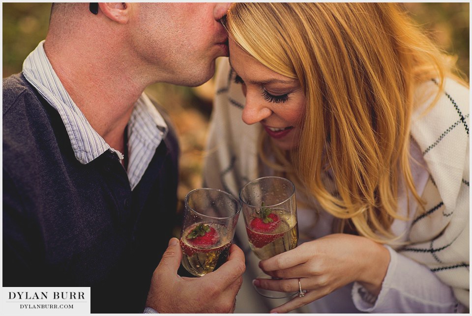 denver fall engagement photos champagne toast with strawberries
