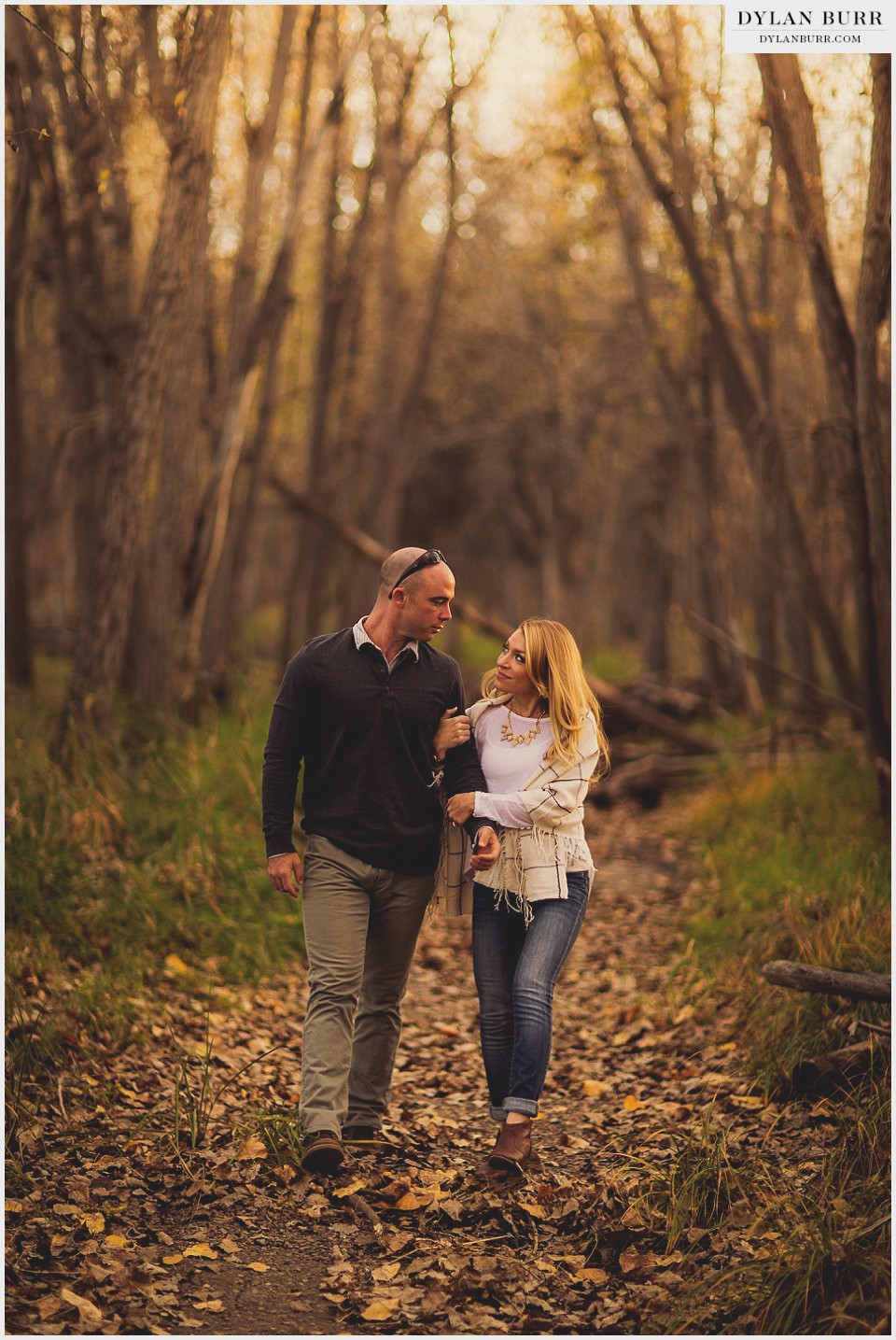 denver fall engagement photos walking arm in arm