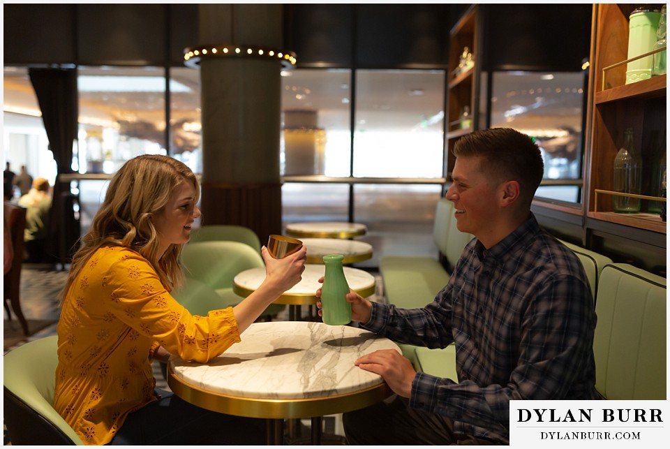 denver engagement photos dairy block downtown denver a couple together with some milk jugs