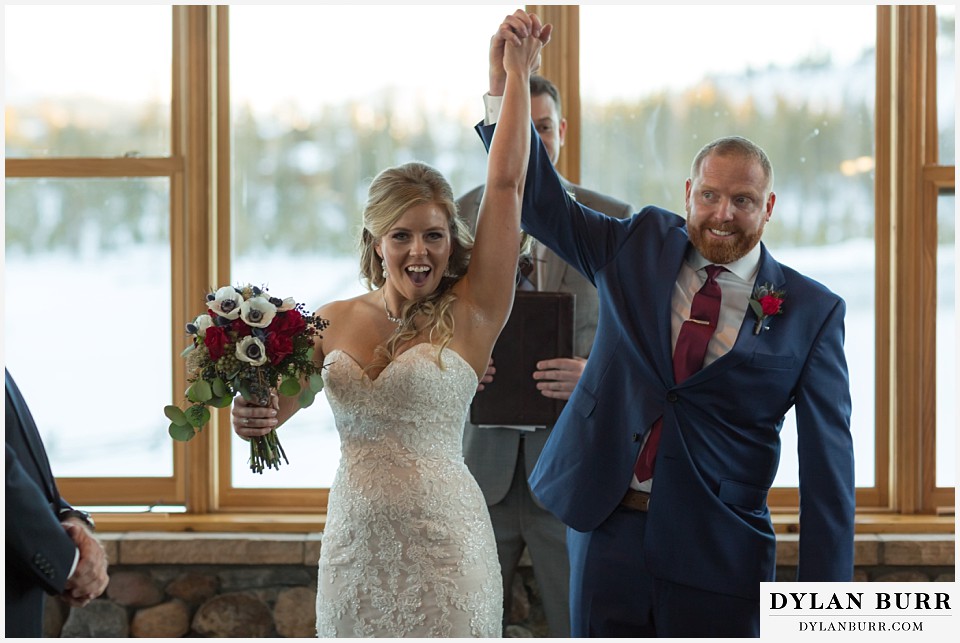 devils thumb ranch wedding in winter ceremony timber house exit