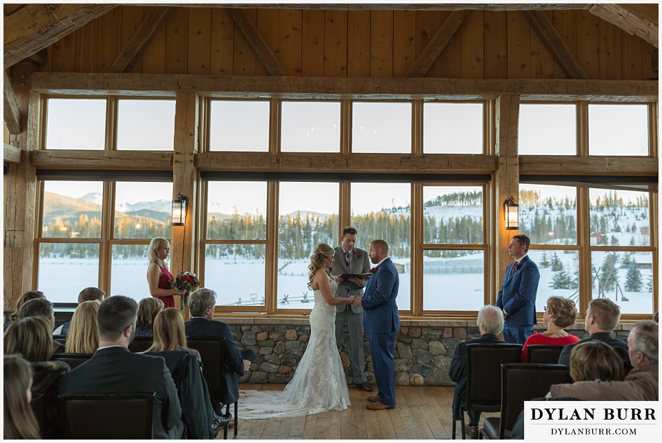 devils thumb ranch wedding in winter/devils thumb ranch wedding in winter ceremony timber house mountain views rings