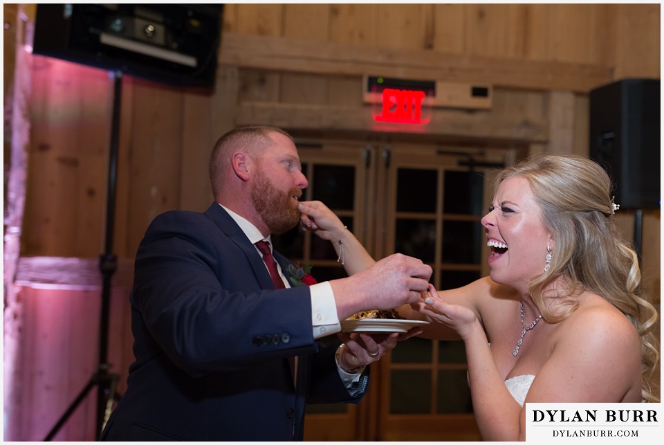 devils thumb ranch wedding in winter funny cake cutting reception