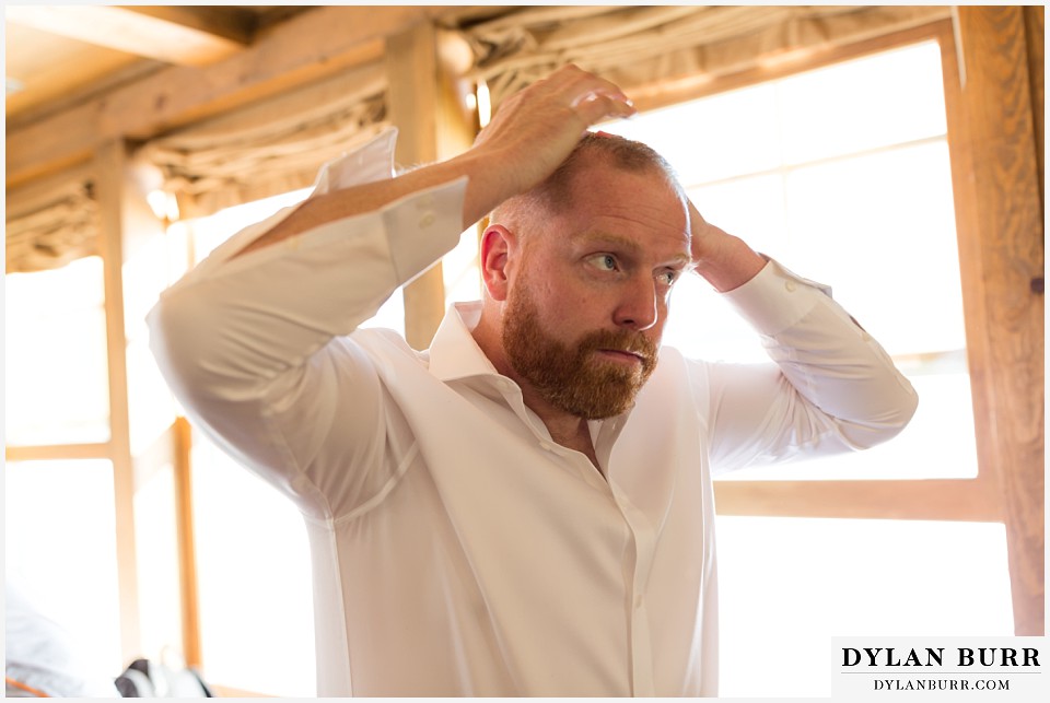 devils thumb ranch wedding in winter groom getting ready