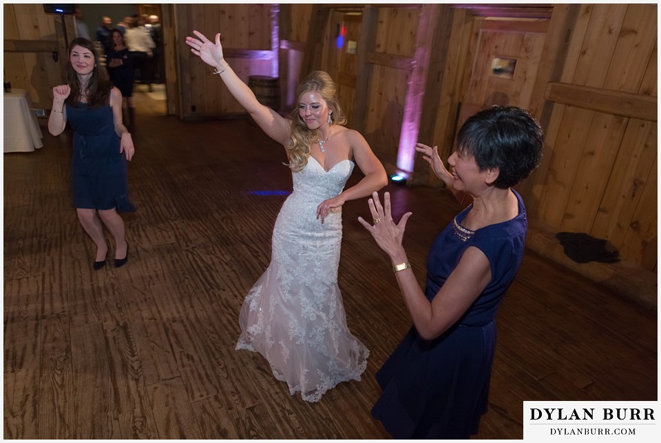 devils thumb ranch wedding in winter reception party bride dancing