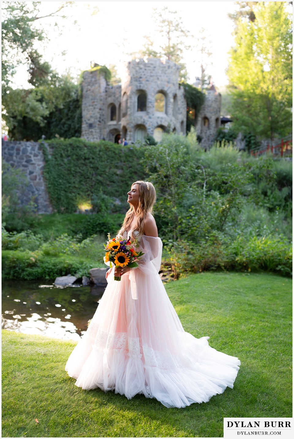 bride outside dunafon castle wedding