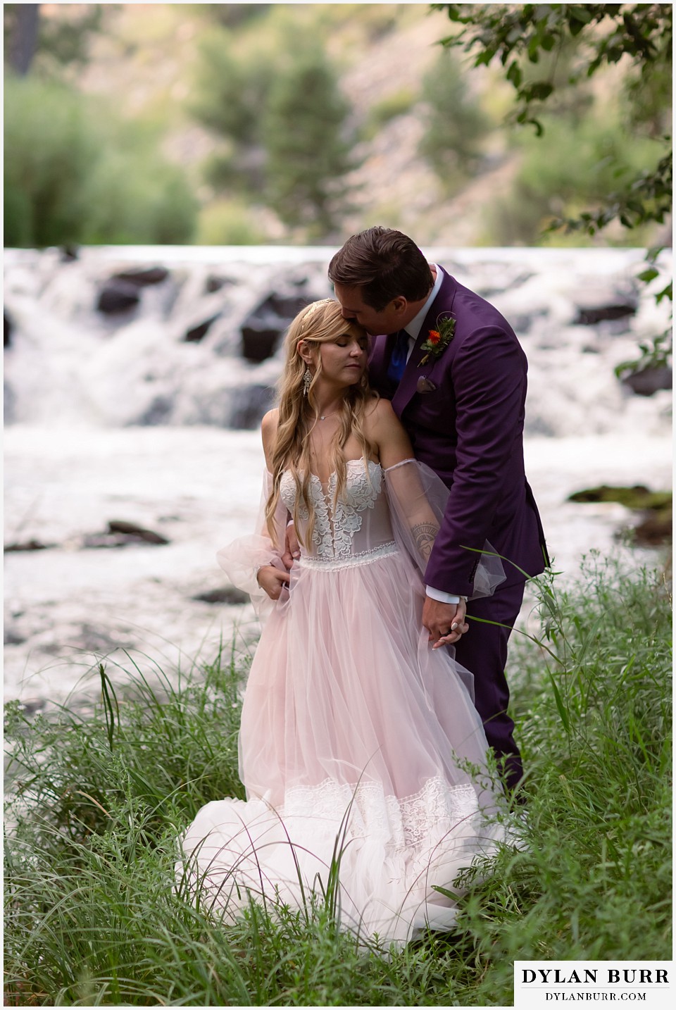 dunafon castle wedding couple near river at sunset