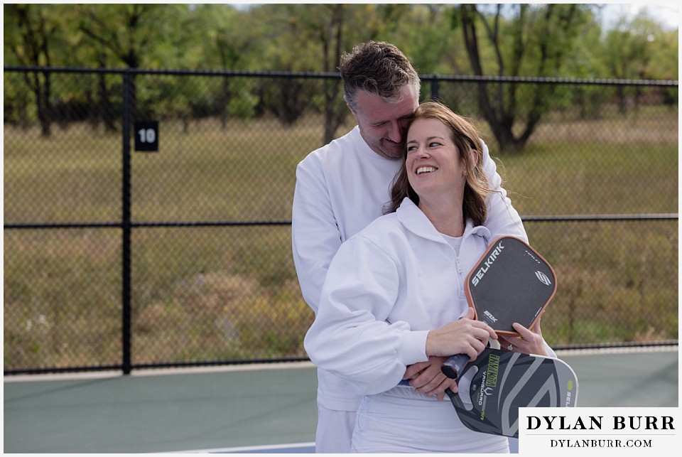 engagement photos at helen hunt falls colorado springs snuggles with pickleball paddles