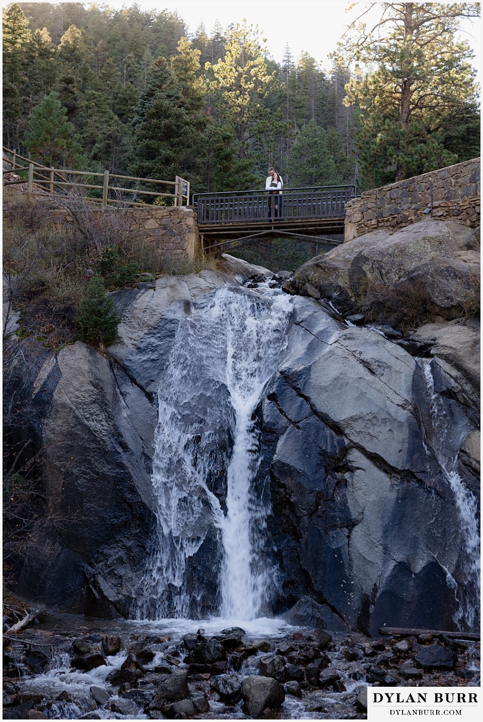 engagement photos at helen hunt falls colorado springs wide shot of the falls with the bridge