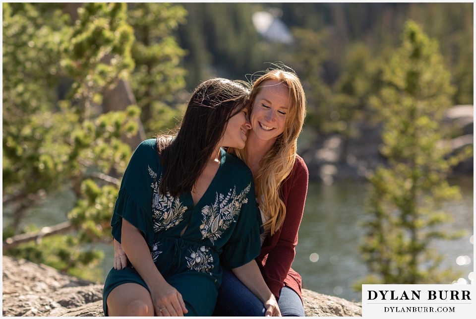 estes park engagement photos couple laughing in mountains