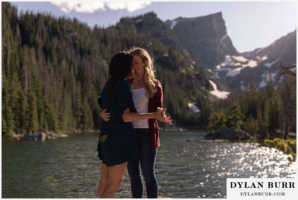 estes park engagement photos dancing and coming in close together