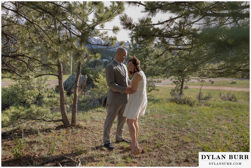 rocky mountain estes park engagement session laughing in pine trees