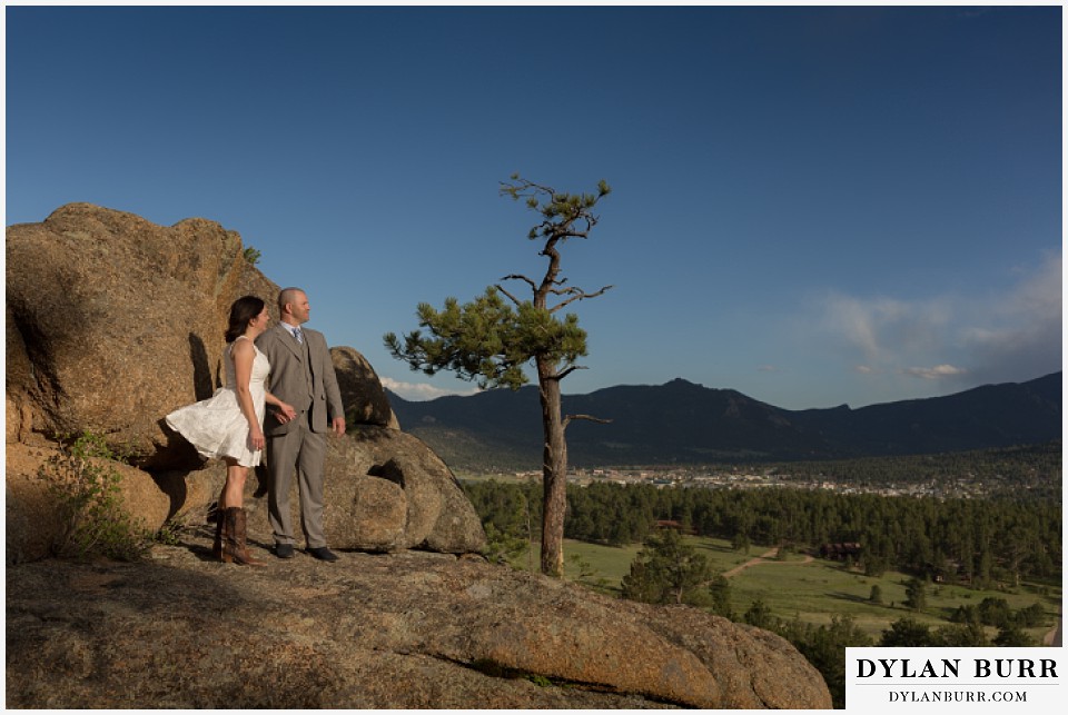 rocky mountain estes park engagement session view of Estes Park and surrounding mountains on large rocks