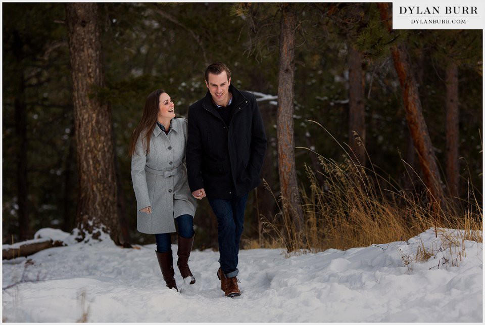 estes park engagement photos walking in snow