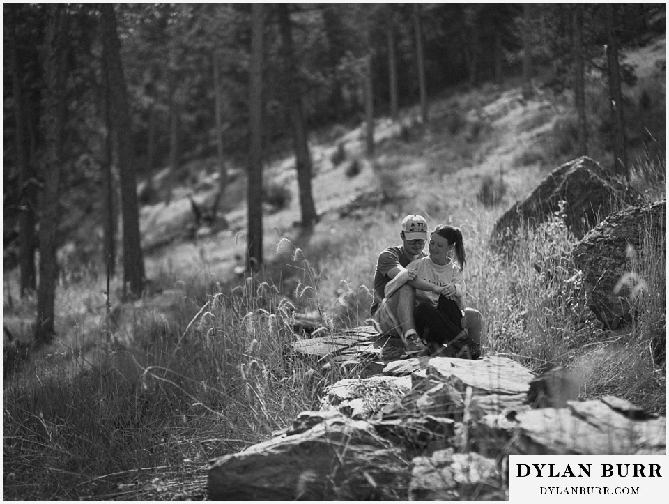 estes park marriage proposal couple resting in mountains