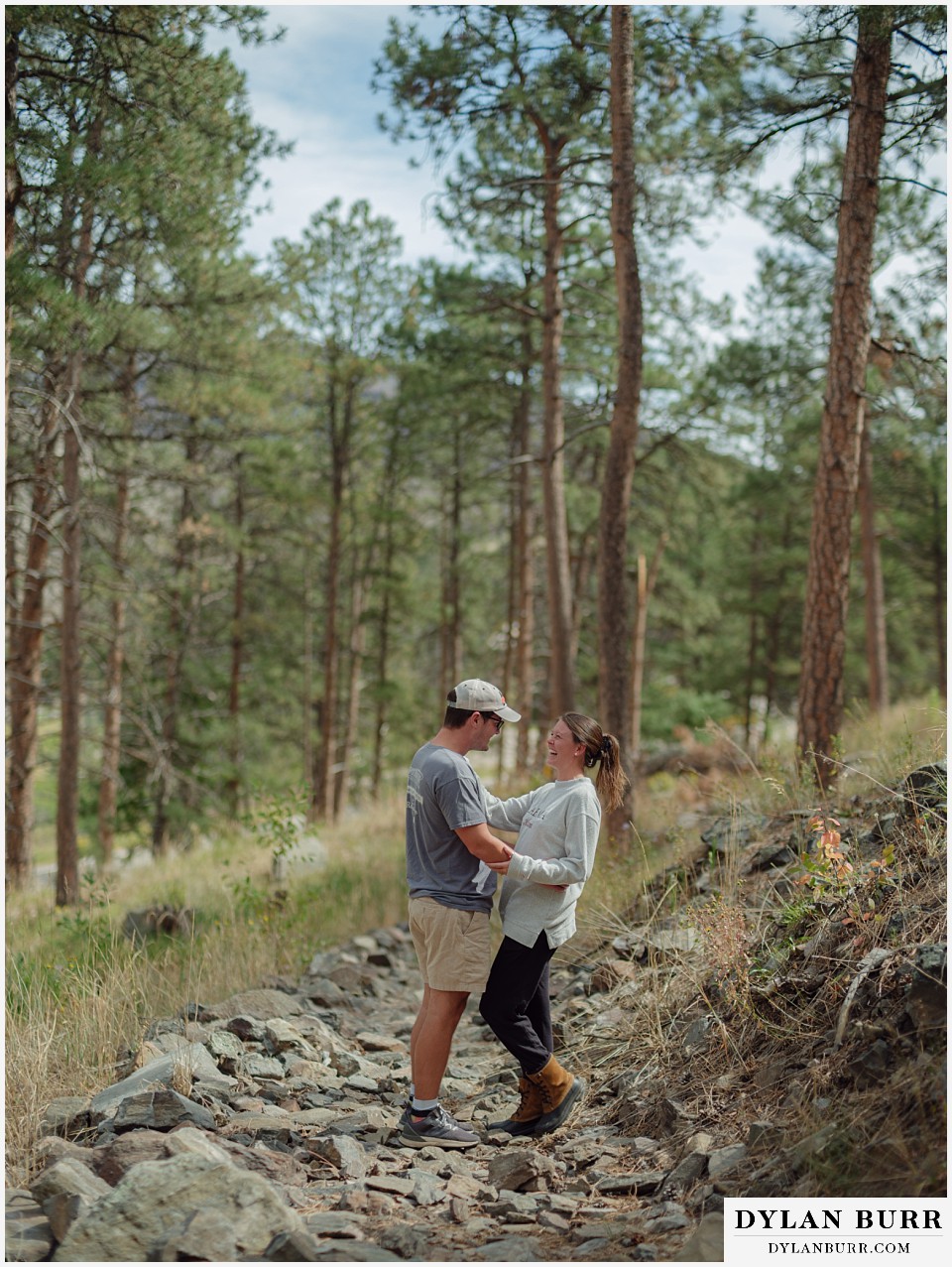 estes park marriage proposal couple on hiking trail in trees
