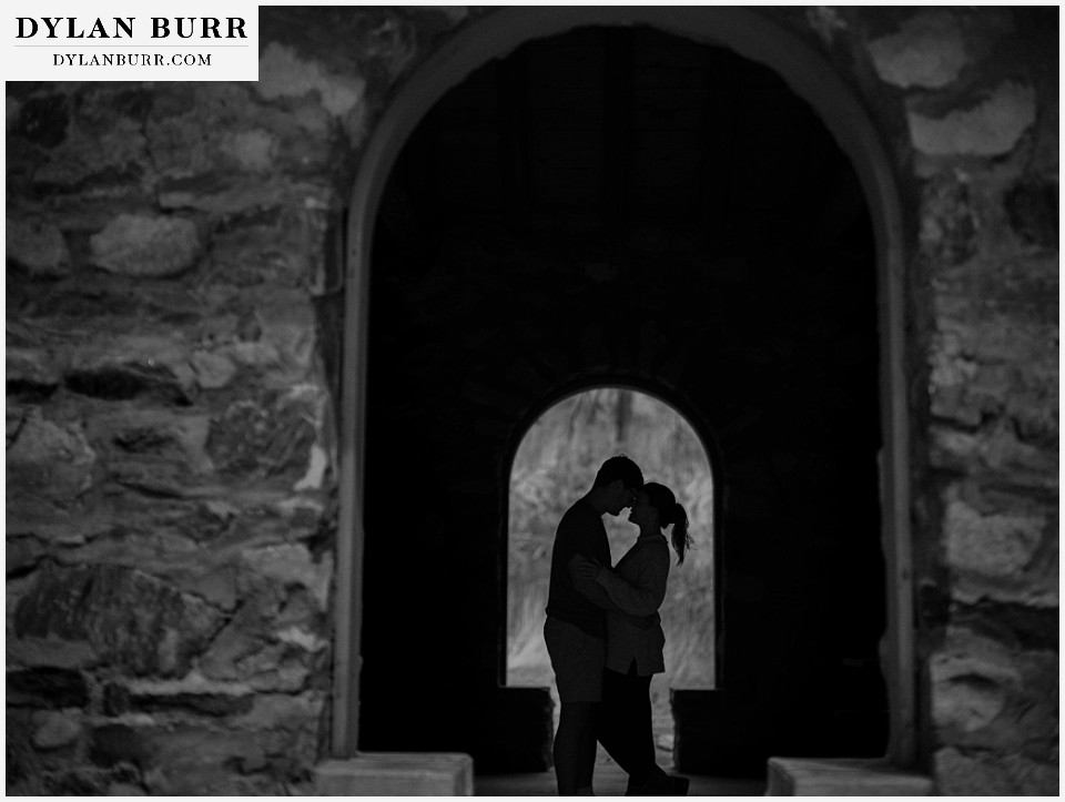 estes park marriage proposal sihouhette of couple in black and white window