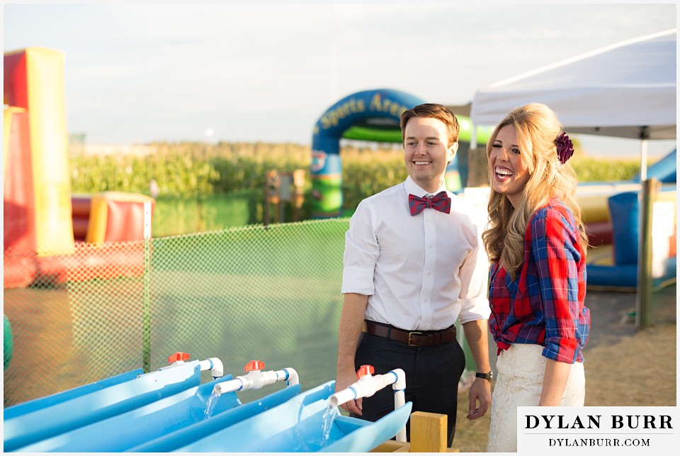 couple at a fall festival racing rubber duckies
