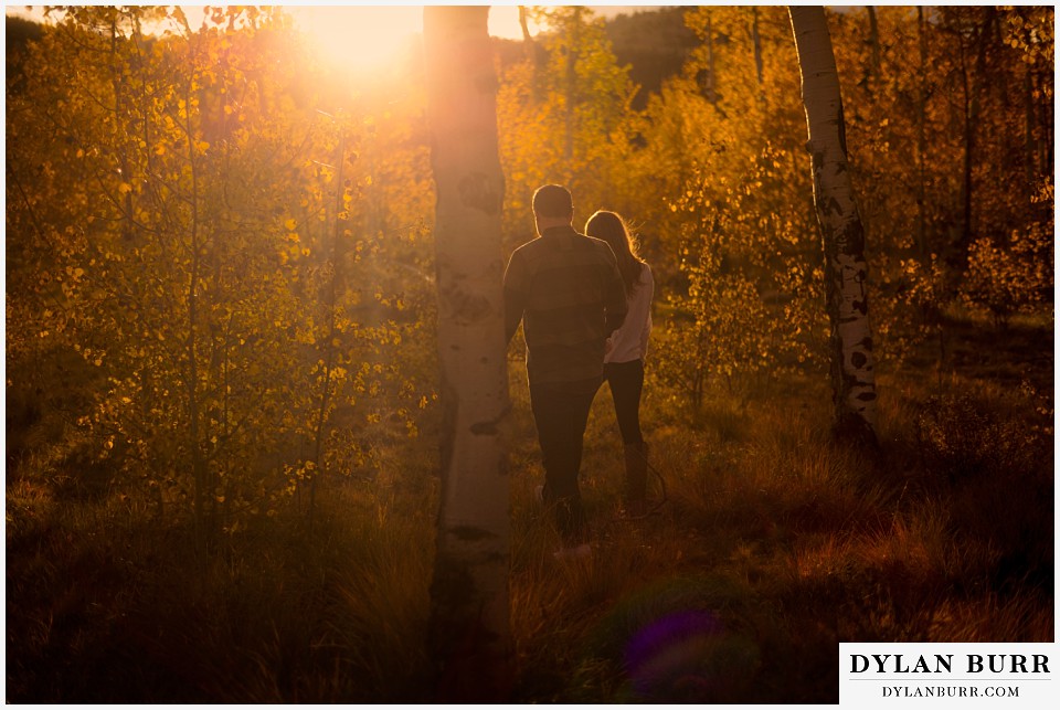 colorado mountains fall engagement photo session walking at sunset