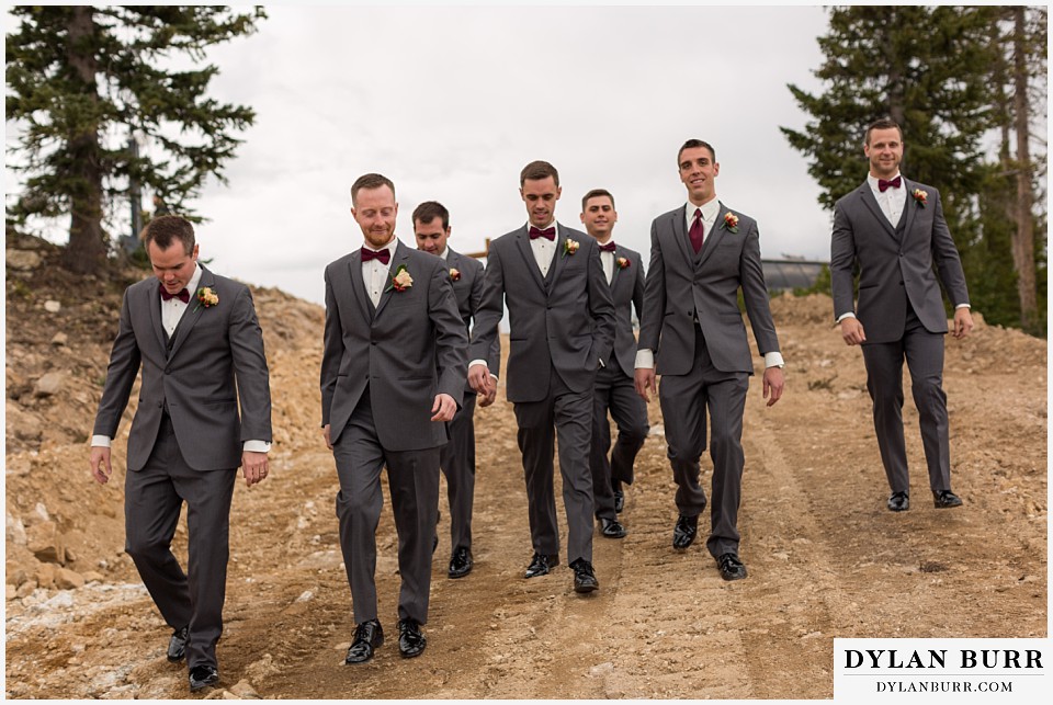 the lodge at sunspot wedding winter park groomsmen walking