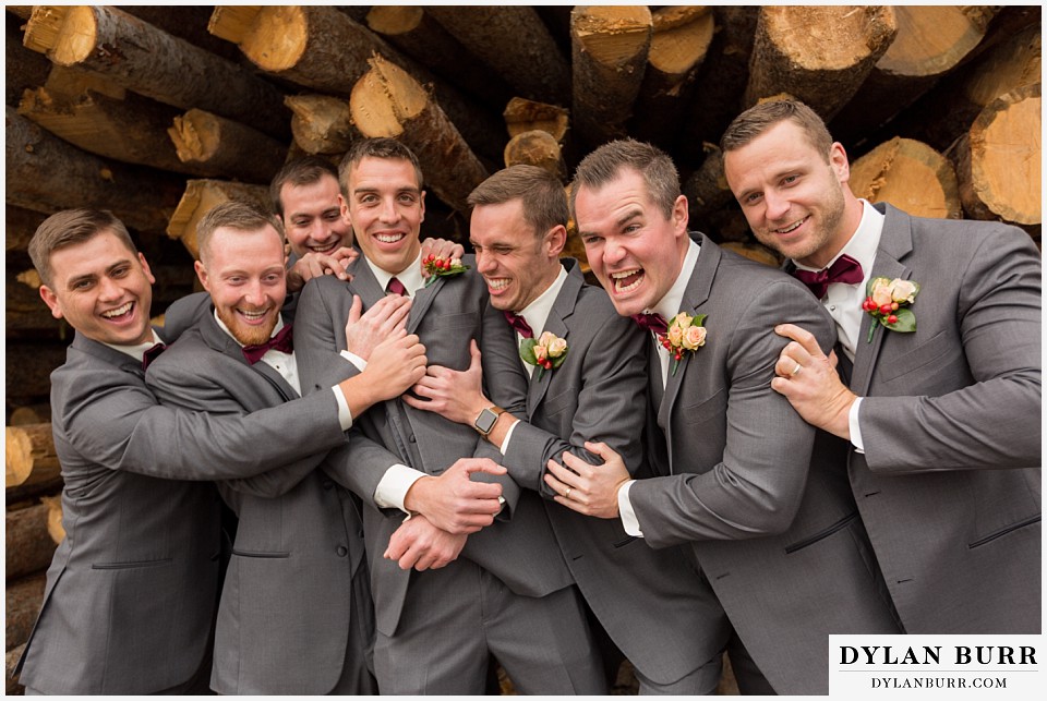 the lodge at sunspot wedding winter park groomsmen having fun