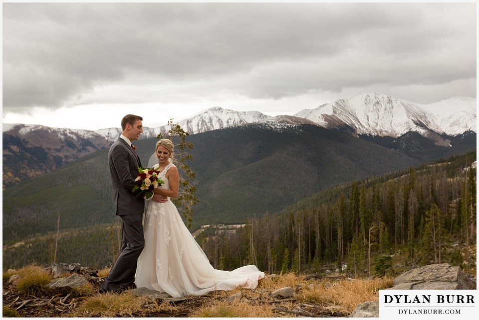 the lodge at sunspot wedding winter park couple on top of mountain