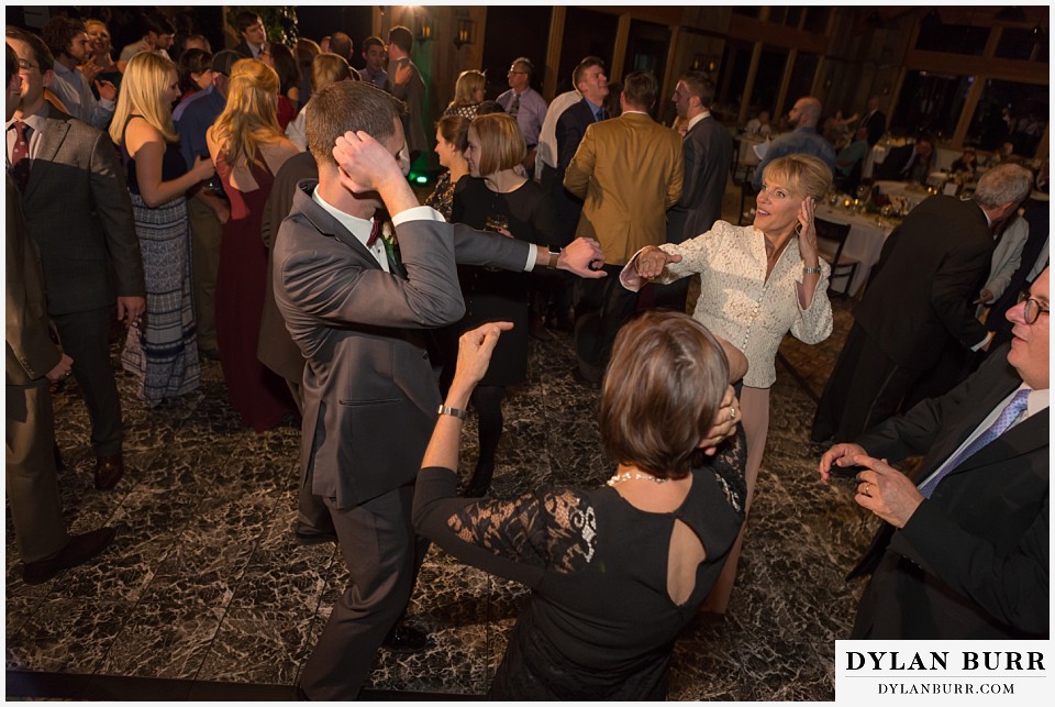 the lodge at sunspot wedding fall mountain wedding winter park reception party groom dancing with mom