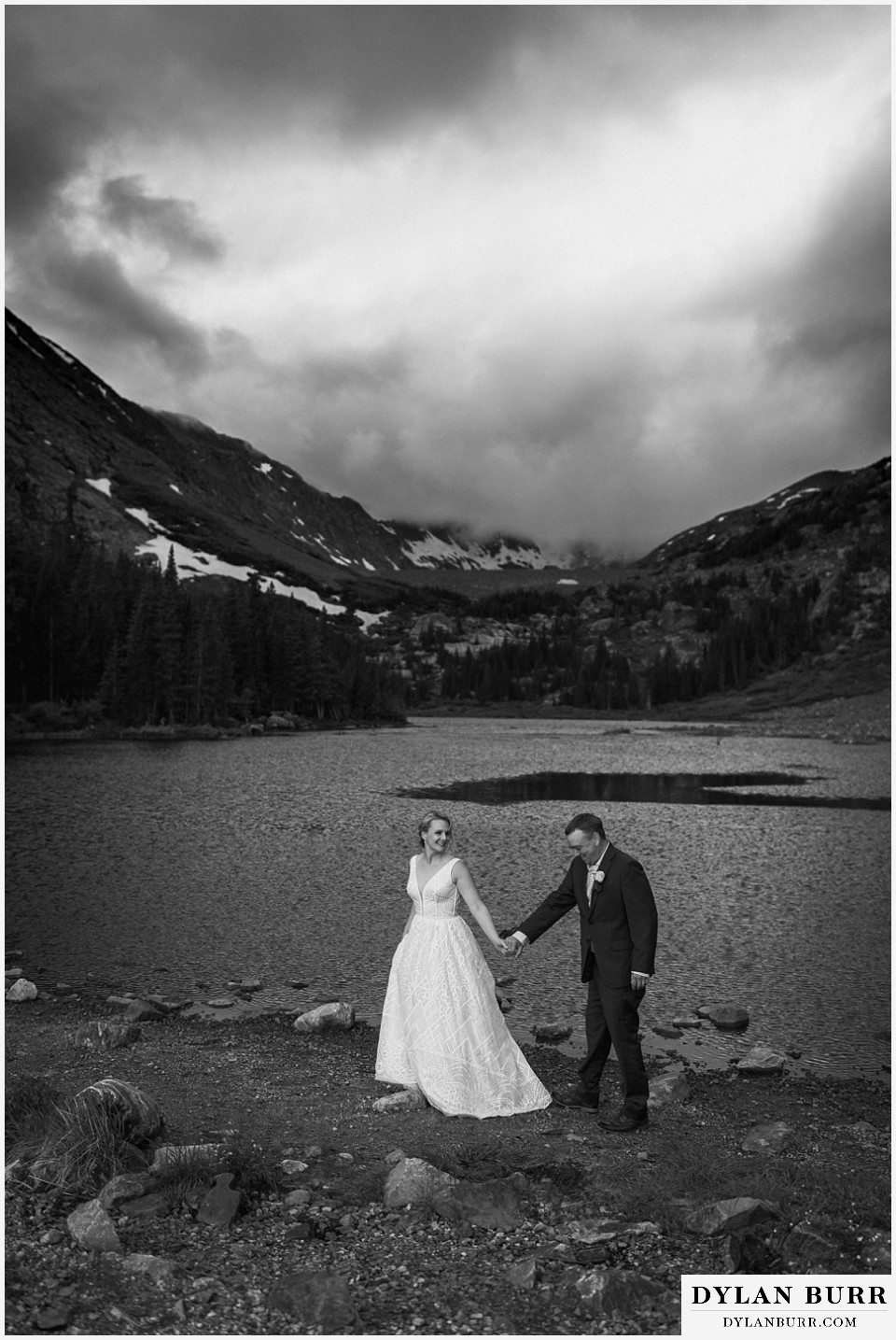 breckenridge blue lakes elopement wedding colorado walking hand in hand by lake