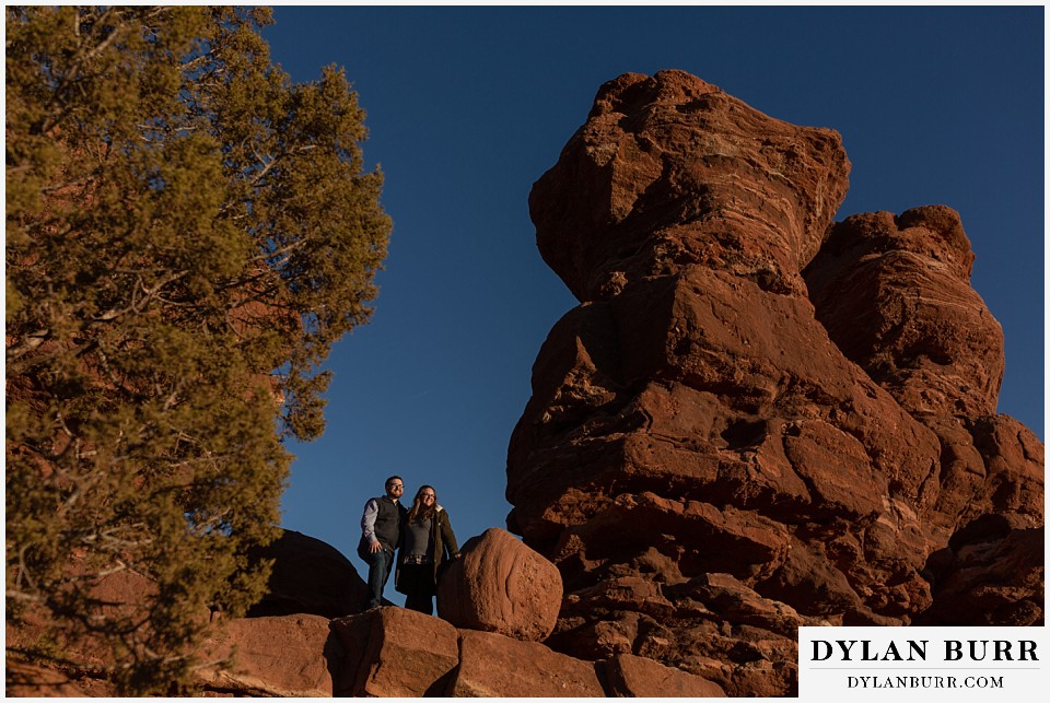 garden of the gods engagement session enjoying the sunset