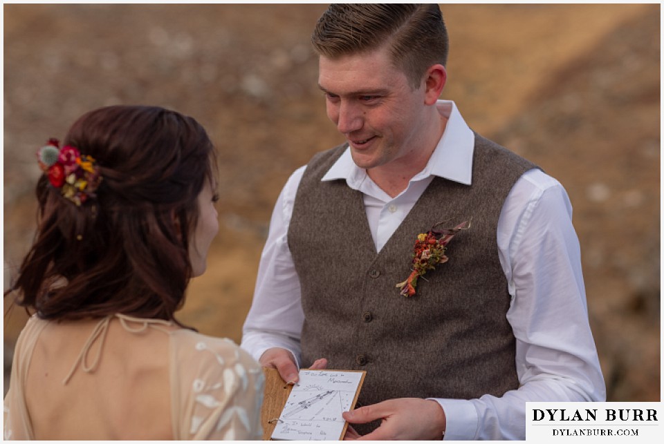 rocky mountain national park grand lake wedding elopement bride and groom reading vows to each other