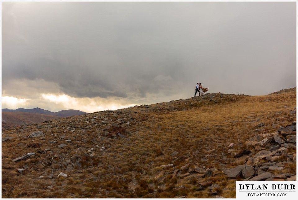 rocky mountain national park grand lake wedding elopement bride and groom with storm in the background