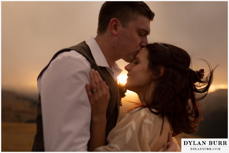 rocky mountain national park grand lake wedding elopement groom kissing brides forehead