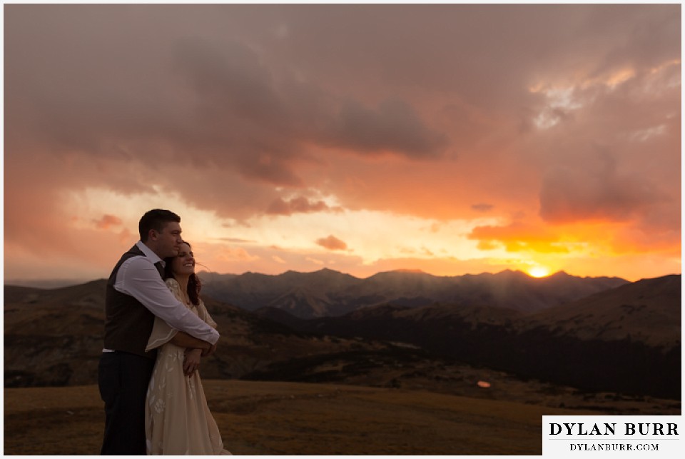 rocky mountain national park grand lake wedding elopement groom and bride laughing in mountains