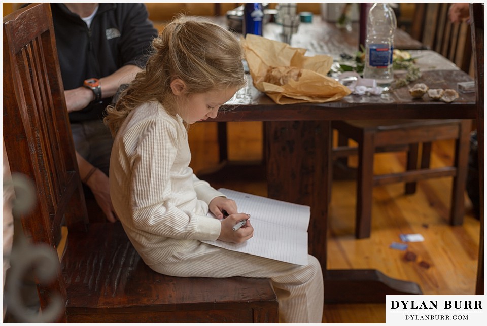 grand teton destination wedding daughter writing note to mom