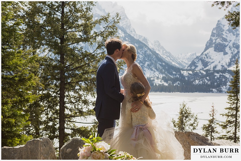 grand teton destination wedding ceremony first kiss